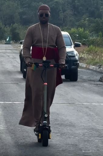 Olu of Warri Rides Scooter to Inspect Road