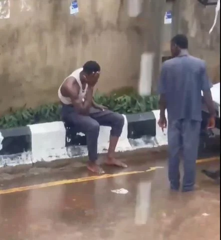 Passersby rescue man from floodwaters in Delta.